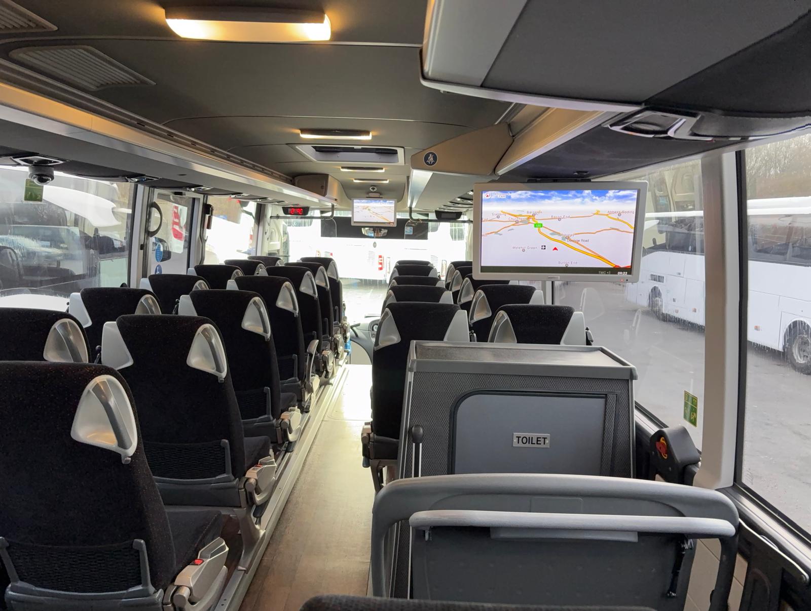 Corporate passengers working on coach with Wi-Fi